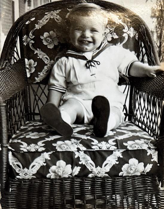A baby sitting in a chair

Description automatically generated with low confidence